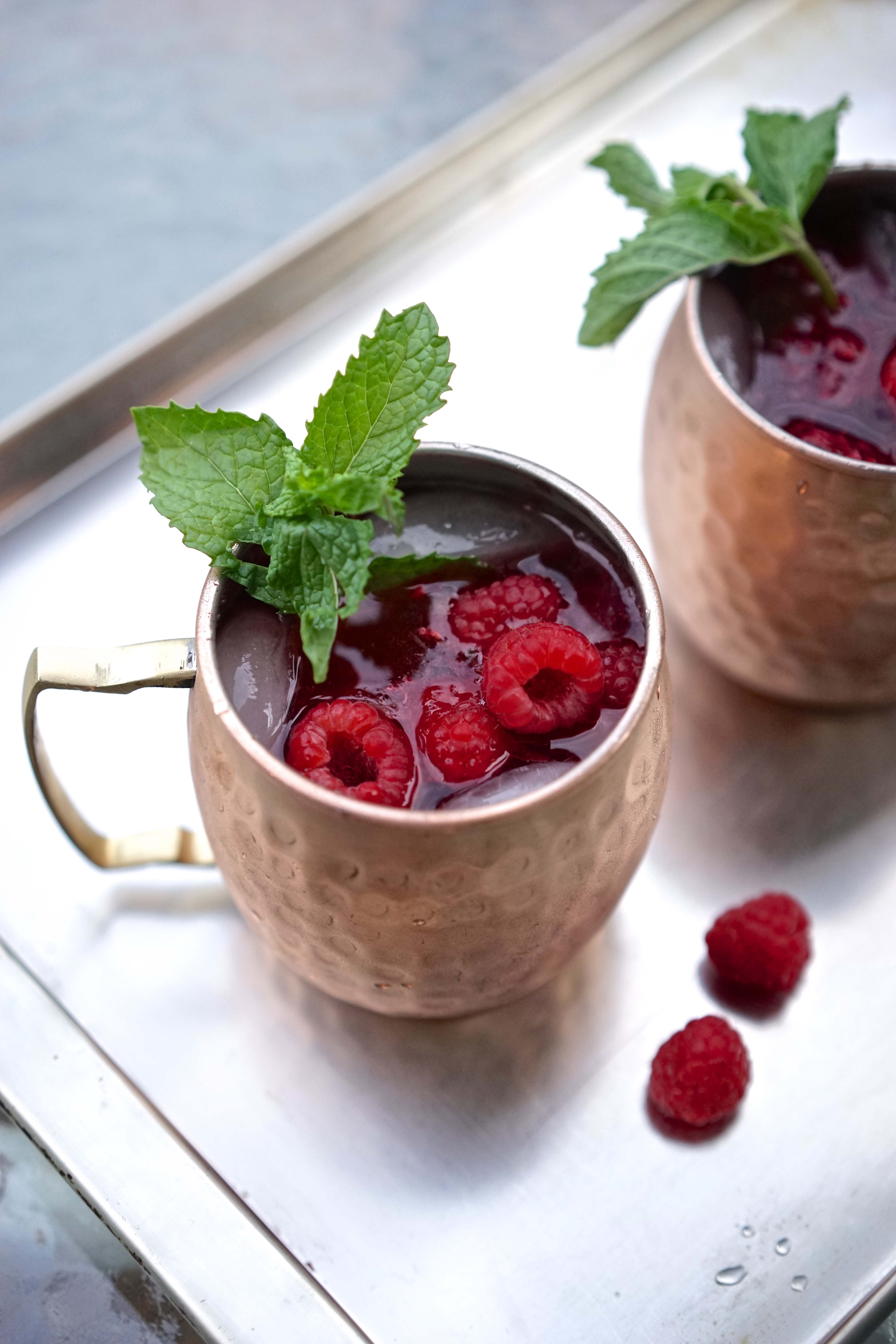 Moscow Mules with Raspberry Lime Zest Ice Cubes & Fresh Mint | Living Healthy in Seattle